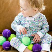 joy street baby zip onesie on baby with tennis balls