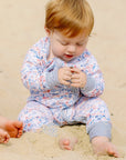 USA baby zip onesie on baby at the beach joy street