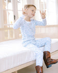 Boy in Dallas Fort-Worth Pajamas & cowboy boots